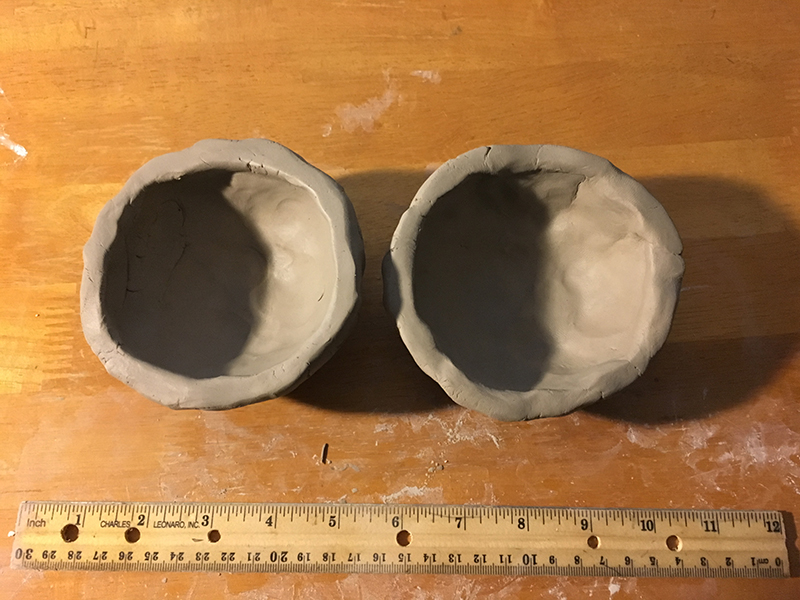 Flatten the edges of each clay bowl
