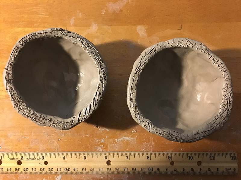 Score and slip the rims of each clay bowl
