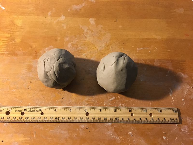 Roll out two balls of clay