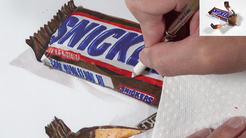 Adding highlights with colored pencils on the wrapper of the candy bar