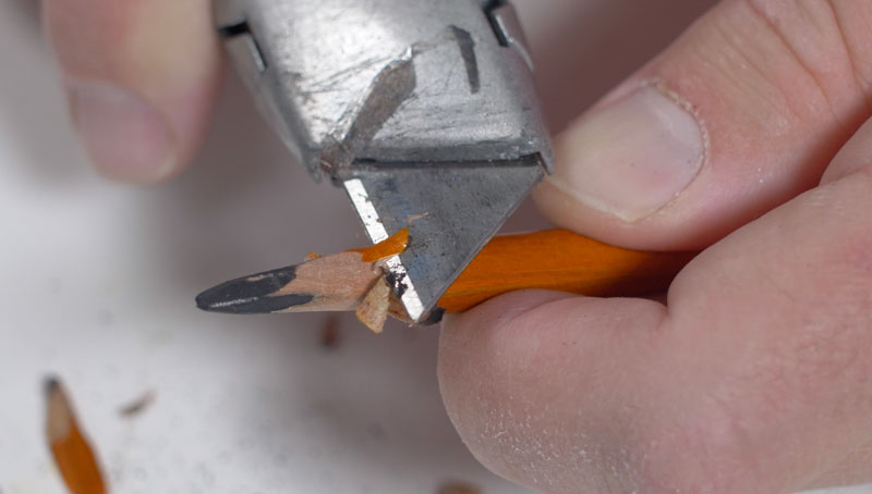 Sharpening a pencil with a knife