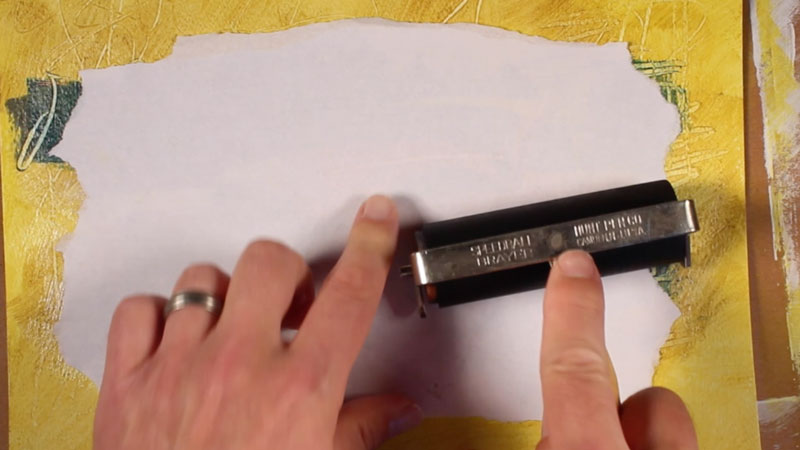 Use a brayer to secure adhesion