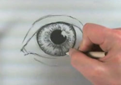 Draw an eye with charcoal - step 3 -layer the pupil