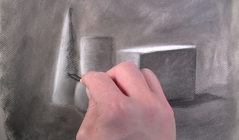 Adding shadows with compressed charcoal pencil