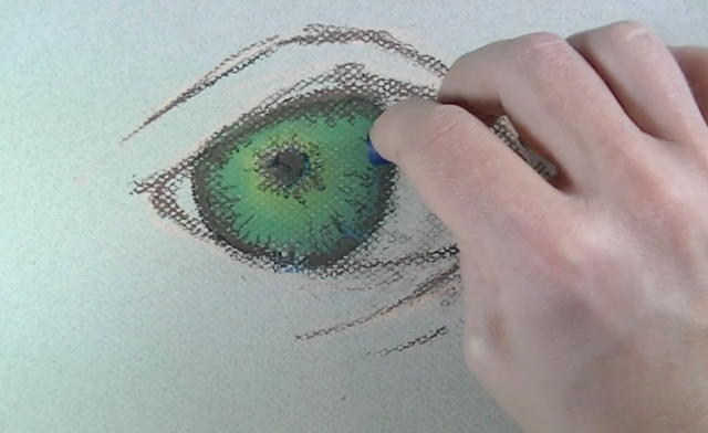 Painting in the darker values of the iris.